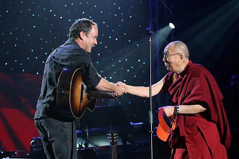 
Dave Matthews and His Holiness the Dalai Lama shake hands onstage at the One World Concert at Syracuse University on October 9, 2012 in Syracuse, New York, USA
